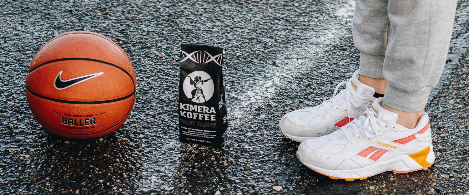 asphalt with basketball coffee and person standing with Reebok Sneakers