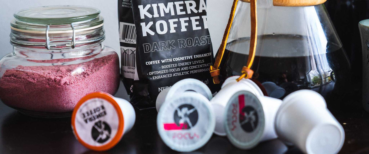 table with jar with red creamer next to dark roast coffee bag next to chemex filter, and coffee pods scattered in the foreground 