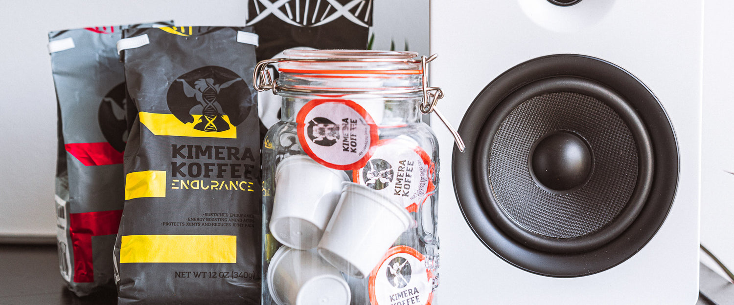 three coffee bags on a table next to a mason jar filled with coffee pods and next to a white speaker